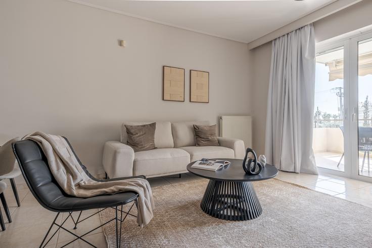 Elegantly designed living room with modern furnishings in an apartment at Building 31i - movingdoors - 1521808 in South Athens, Athens