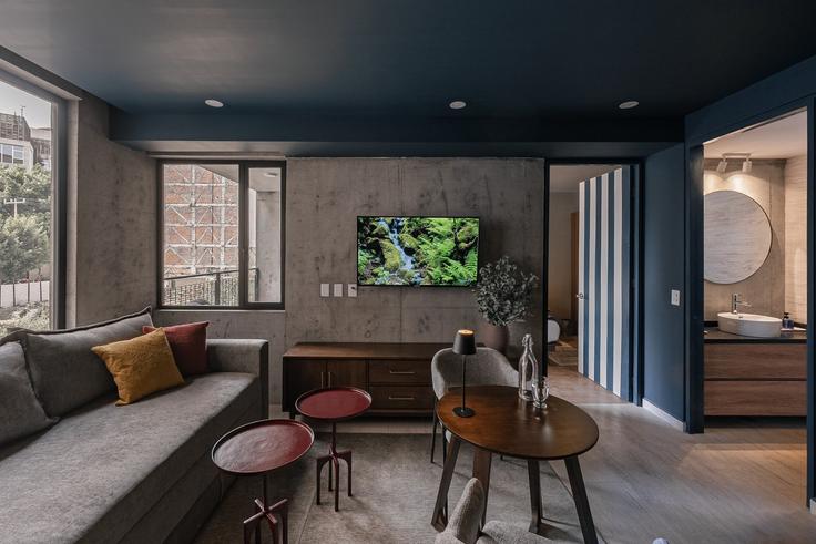 Elegantly designed living room with modern furnishings in an apartment at Building Avenida Veracruz - mr-herold-homes - 1515028 in Mexico City, Mexico City
