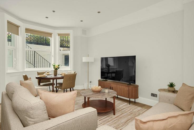 Elegantly designed living room with modern furnishings in an apartment at Building Gwendwr Road - murray-stays-limited - 1515913 in London Borough of Hammersmith and Fulham, London Elegantly designed living room with modern furnishings in an apartment at Building Gwendwr Road - murray-stays-limited - 1515913 in London Borough of Hammersmith and Fulham, London
