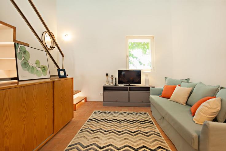 Sala de estar elegantemente projetada com móveis modernos em um apartamento no Building Rua Arquiteto Eduardo Souto Moura - my-choice-algarve - 1363451 em Santa Maria, Tavira