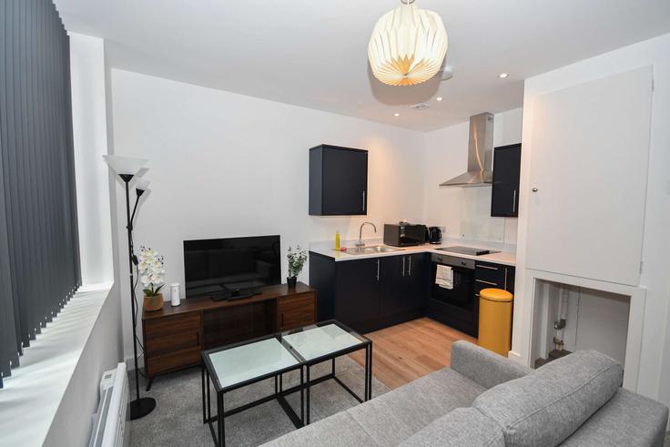 Elegante sala de estar con mobiliario moderno en un apartamento en Building Well Street - mypropertyhost - 1605293 en City of Bradford, Bradford Elegante sala de estar con mobiliario moderno en un apartamento en Building Well Street - mypropertyhost - 1605293 en City of Bradford, Bradford