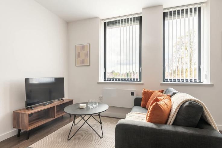 Elegante sala de estar con mobiliario moderno en un apartamento en Building Holgate Park Drive - mypropertyhost - 1270641 - LON en York, York Elegante sala de estar con mobiliario moderno en un apartamento en Building Holgate Park Drive - mypropertyhost - 1270641 - LON en York, York