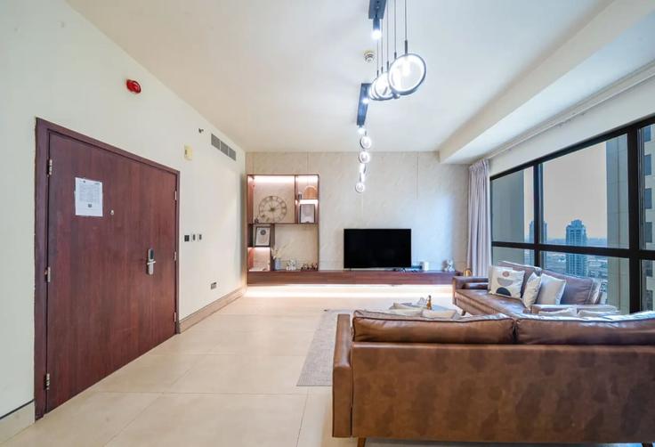 Elegantly designed living room with modern furnishings in an apartment at Building Al Sayorah Street - naseem - 1383992 in Dubai Marina, Dubai