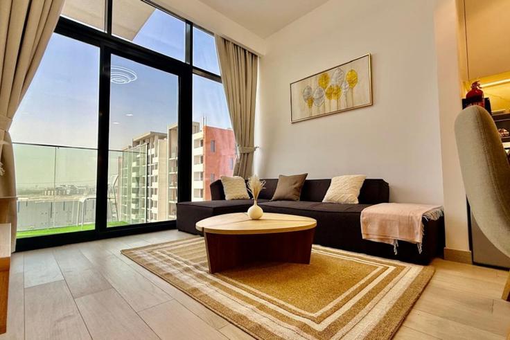 Dubai Nad Al ShebaのBuilding Tariaq Bedon Esm - naseem - 1384002のアパートメントにある、モダンな家具を備えたエレガントなデザインのリビングルーム