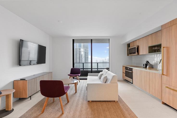 Elegantly designed living room with modern furnishings in an apartment at Building Northeast 6th Street - nomad - 1389643 in Miami, Miami