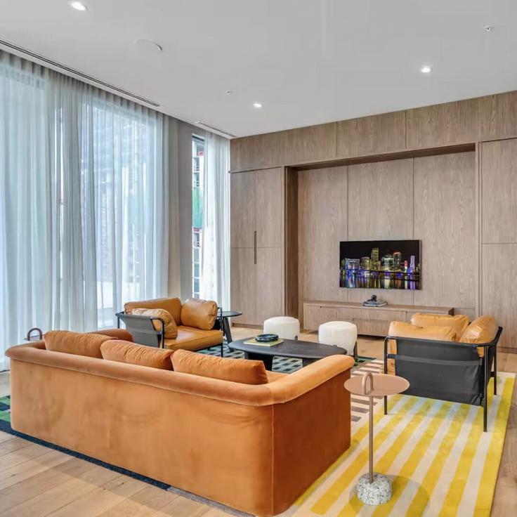 Elegantly designed living room with modern furnishings in an apartment at Building Northeast 6th Street - nomad - 1389644 in Miami, Miami
