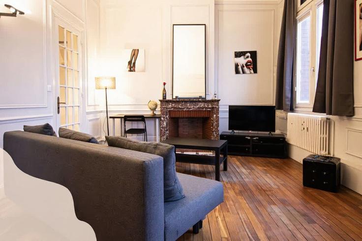 Elegante sala de estar con mobiliario moderno en un apartamento en Building Rue Bayard - nordnest - 1438737 en Lens, Lens