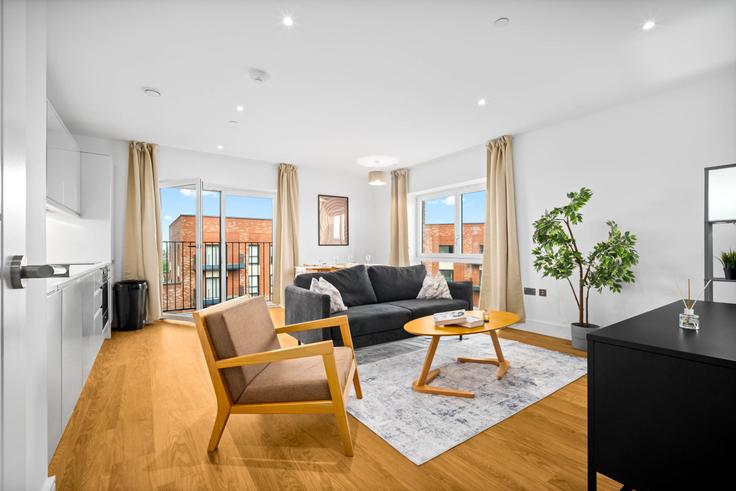 Salle de séjour élégante avec mobilier moderne dans un appartement à Building Hooper Street - nuvo-hotel-group-ltd - 1537926 à Birmingham District, Birmingham Salle de séjour élégante avec mobilier moderne dans un appartement à Building Hooper Street - nuvo-hotel-group-ltd - 1537926 à Birmingham District, Birmingham