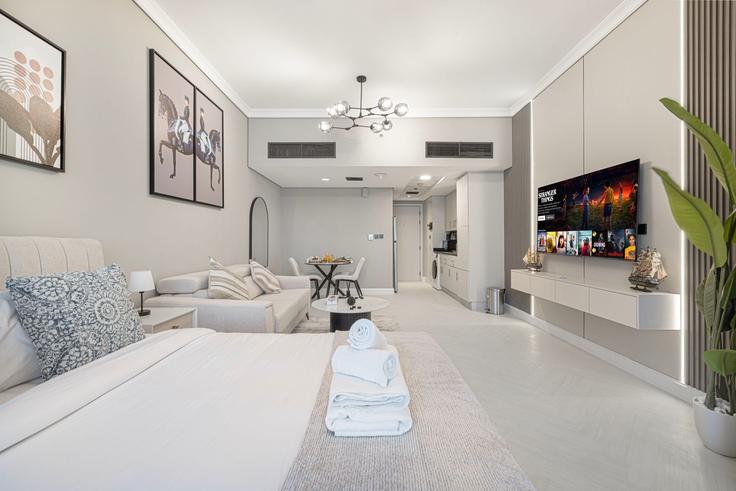 Elegante sala de estar con mobiliario moderno en un apartamento en Building Cluster D - oak-tree-vacation-homes-rental - 1346918 en JLT, Dubai Elegante sala de estar con mobiliario moderno en un apartamento en Building Cluster D - oak-tree-vacation-homes-rental - 1346918 en JLT, Dubai