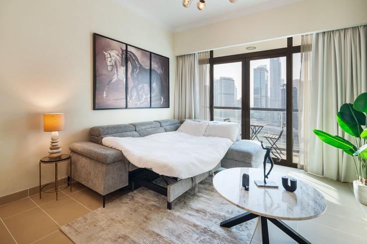 Elegante sala de estar con mobiliario moderno en un apartamento en Building Cluster A - oak-tree-vacation-homes-rental - 1316358 en JLT, Dubai Elegante sala de estar con mobiliario moderno en un apartamento en Building Cluster A - oak-tree-vacation-homes-rental - 1316358 en JLT, Dubai