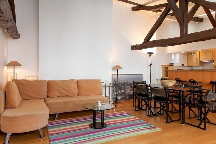 Elegantly designed living room with modern furnishings in an apartment at Building Rue Cambon - oasis - 1013369 in 1st arrondissement, Paris