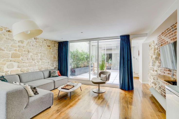 Sala de estar elegantemente projetada com móveis modernos em um apartamento no Building Rue de Picardie - oasis - 1013411 - PAR em 3rd arrondissement, Paris Sala de estar elegantemente projetada com móveis modernos em um apartamento no Building Rue de Picardie - oasis - 1013411 - PAR em 3rd arrondissement, Paris