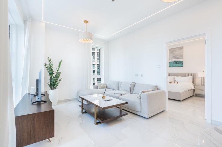 Elegant gestaltetes Wohnzimmer mit moderner Einrichtung in einer Wohnung im Building Sheikh Mohammed bin Rashid Boulevard - ocleyhomes-hostaway - 1047334 - DXB in Downtown Dubai, Dubai