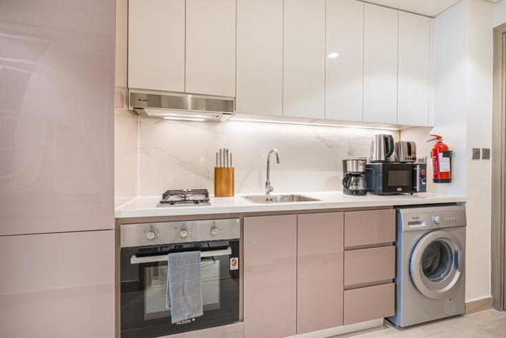 Functional and stylish kitchen with top-of-the-line equipment in an upscale apartment at Building Tariaq Bedon Esm - ocleyhomes-hostaway - 1328950 in Nad Al Sheba, Dubai
