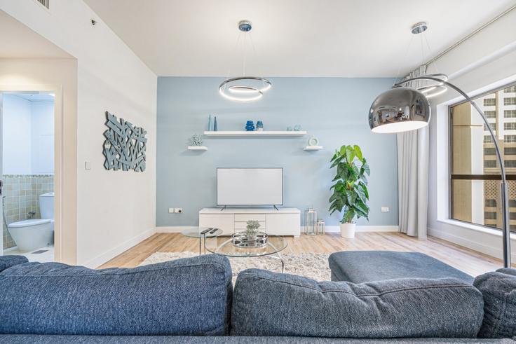 Elegantly designed living room with modern furnishings in an apartment at Building Al Gharbi Street - ocleyhomes-hostaway - 1343029 in Dubai Marina, Dubai Elegantly designed living room with modern furnishings in an apartment at Building Al Gharbi Street - ocleyhomes-hostaway - 1343029 in Dubai Marina, Dubai