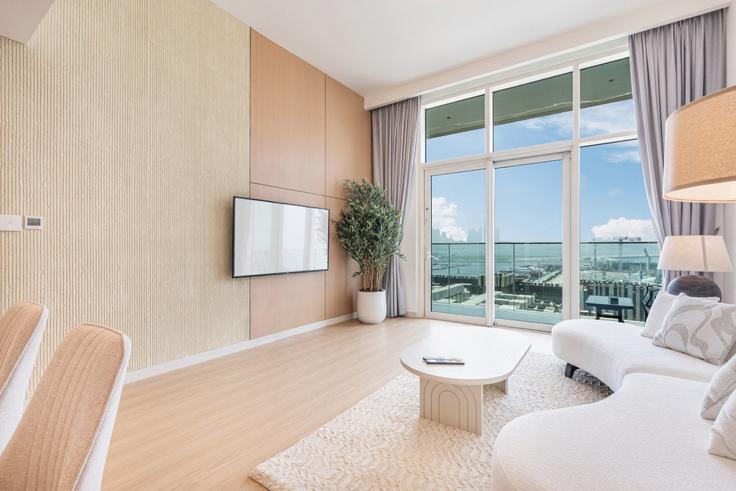 The Palm Jumeirah, Dubai 소재 Building Tariaq Bedon Esm - ocleyhomes-hostaway - 1262265 - DXB 유닛에 마련된, 현대적인 가구로 꾸며진 우아한 디자인의 거실