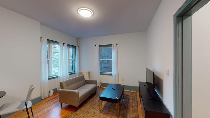 Elegante sala de estar con mobiliario moderno en un apartamento en Building Washington Street - ojh - 1501167 en Boston, Boston