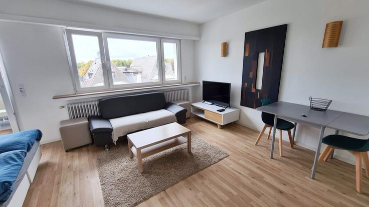 Elegantly designed living room with modern furnishings in an apartment at Building Boulevard de la Pétrusse - omlu-sarl - 1342605 in Luxembourg, Luxembourg