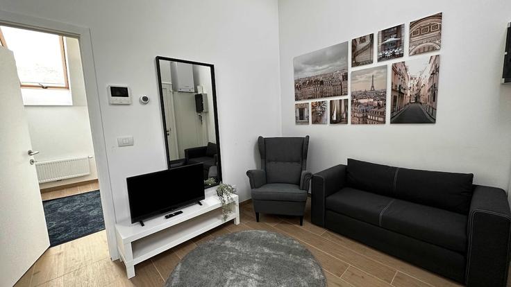 Salle de séjour élégante avec mobilier moderne dans un appartement à Building Sint-Jozefstraat - one-lux-stay - 1606953 à Antwerp, Antwerp Salle de séjour élégante avec mobilier moderne dans un appartement à Building Sint-Jozefstraat - one-lux-stay - 1606953 à Antwerp, Antwerp