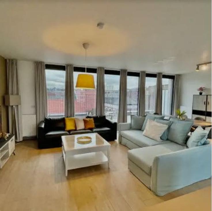Salle de séjour élégante avec mobilier moderne dans un appartement à Building Lange Leemstraat - one-lux-stay - 1606944 à Antwerp, Antwerp Salle de séjour élégante avec mobilier moderne dans un appartement à Building Lange Leemstraat - one-lux-stay - 1606944 à Antwerp, Antwerp