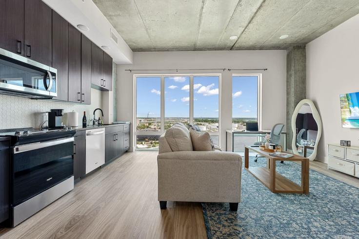 Elegantly designed living room with modern furnishings in an apartment at Building North 12th Street - one-stone-tampa - 1312521 - TPA in Tampa, Tampa