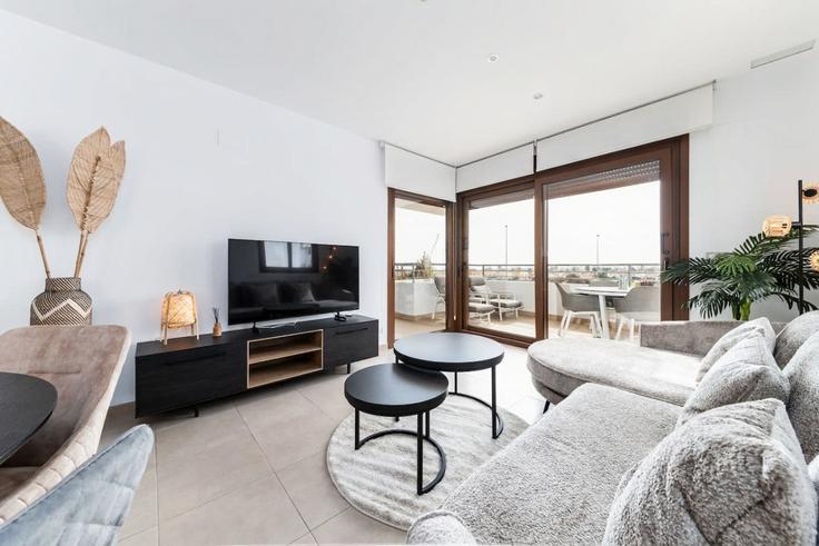 Elegantly designed living room with modern furnishings in an apartment at Building Calle Cabo Santa Maria - oyoostays - 1521945 in Orihuela, Orihuela