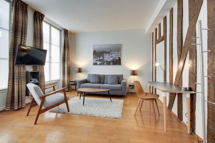 Paris 2nd arrondissementのBuilding Square Pierre Lazareff - paris-appartements-services - 1523234のアパートメントにある、モダンな家具を備えたエレガントなデザインのリビングルーム