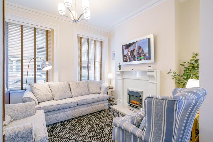 Elegante sala de estar con mobiliario moderno en un apartamento en Building Joy Street - passthekeyss - 1620656 en Belfast, Belfast Elegante sala de estar con mobiliario moderno en un apartamento en Building Joy Street - passthekeyss - 1620656 en Belfast, Belfast
