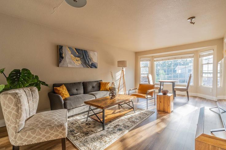 Elegantly designed living room with modern furnishings in an apartment at Building Stone Avenue North - phinney-ridge-properties - 1364261 in Seattle, Seattle