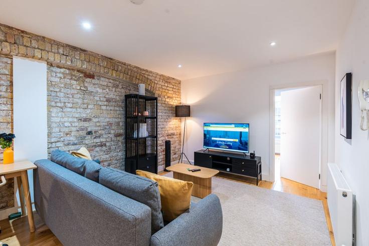 Elegant gestaltetes Wohnzimmer mit moderner Einrichtung in einer Wohnung im Building Farringdon Road - plotseeker-limited-1 - 1625449 in London Borough of Islington, London Elegant gestaltetes Wohnzimmer mit moderner Einrichtung in einer Wohnung im Building Farringdon Road - plotseeker-limited-1 - 1625449 in London Borough of Islington, London