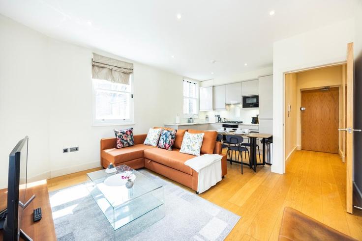 Sala de estar elegantemente projetada com móveis modernos em um apartamento no Building Great Titchfield Street - plotseeker-limited-1 - 1625460 em City of Westminster, London Sala de estar elegantemente projetada com móveis modernos em um apartamento no Building Great Titchfield Street - plotseeker-limited-1 - 1625460 em City of Westminster, London