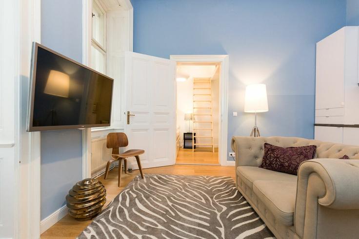 Salle de séjour élégante avec mobilier moderne dans un appartement à Building Graben - prestige-apartments - 1512913 à Vienna, Vienna