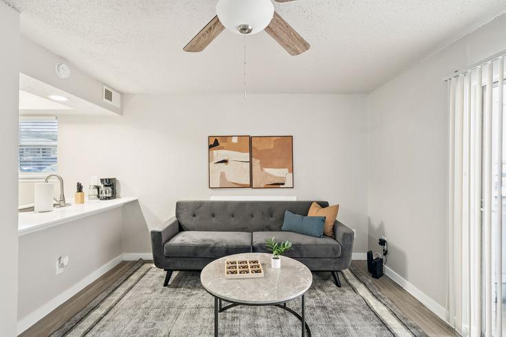 Elegantly designed living room with modern furnishings in an apartment at Building Audelia Road - properties-by-preston-1 - 1613200 in Dallas, Dallas Elegantly designed living room with modern furnishings in an apartment at Building Audelia Road - properties-by-preston-1 - 1613200 in Dallas, Dallas