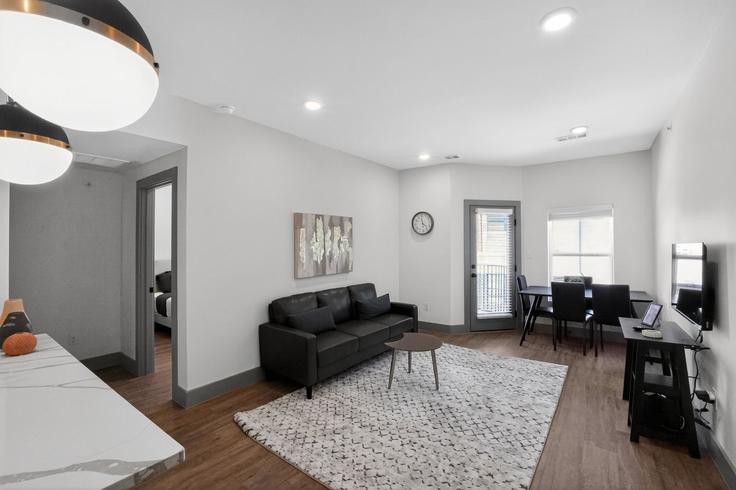 Elegantly designed living room with modern furnishings in an apartment at Building Wickersham Lane - properties-by-preston-1 - 1613059 in Austin, Austin
