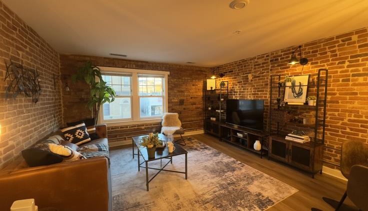 Elegantly designed living room with modern furnishings in an apartment at Building Florida Avenue Northwest - pure-voyage - 1403625 in Washington, Washington