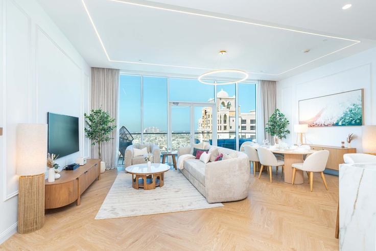 Elegante sala de estar con mobiliario moderno en un apartamento en Building Marina Residence 1 - pvh-vacation-homes - 1490122 en The Palm Jumeirah, Dubai