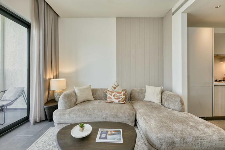 Elegantly designed living room with modern furnishings in an apartment at Building Tariaq Bedon Esm - pvh-vacation-homes - 1471413 in Nad Al Sheba, Dubai