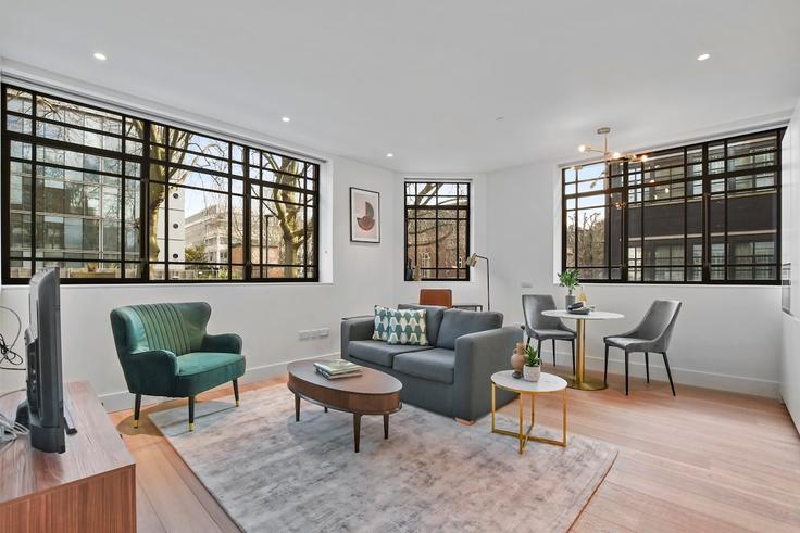 Elegantly designed living room with modern furnishings in an apartment at Building Maple Street - q-apartments-uk-ltd - 1591064 in City of Westminster, London Elegantly designed living room with modern furnishings in an apartment at Building Maple Street - q-apartments-uk-ltd - 1591064 in City of Westminster, London