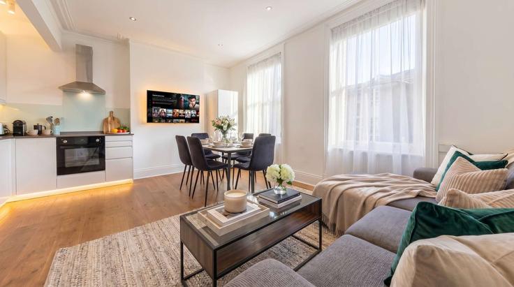 Elegantly designed living room with modern furnishings in an apartment at Building Brook Drive - regal-realms - 1591608 in London Borough of Southwark, London