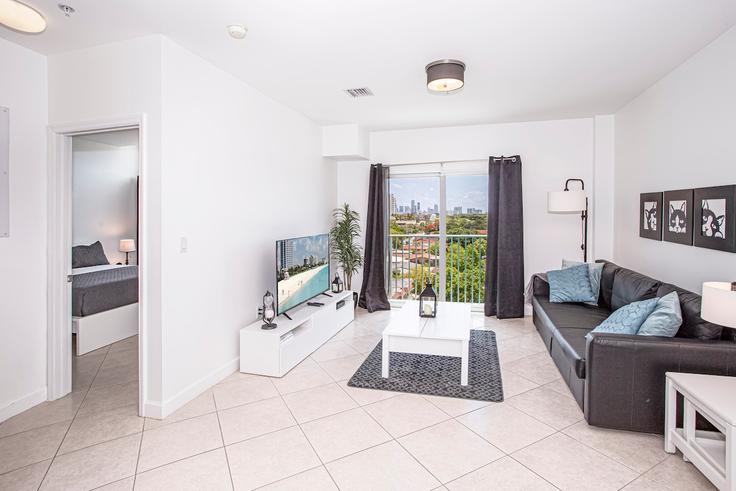 Elegantly designed living room with modern furnishings in an apartment at Building Southwest 32nd Avenue - rent-relax - 1056250 - MIA in Miami, Miami Elegantly designed living room with modern furnishings in an apartment at Building Southwest 32nd Avenue - rent-relax - 1056250 - MIA in Miami, Miami