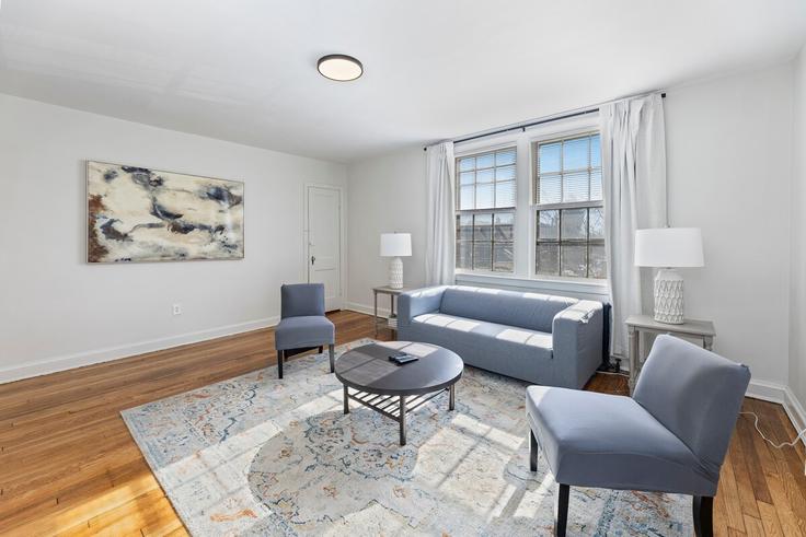 Elegantly designed living room with modern furnishings in an apartment at Building Alabama Avenue Southeast - ridge-realty - 1468518 in Washington, Washington