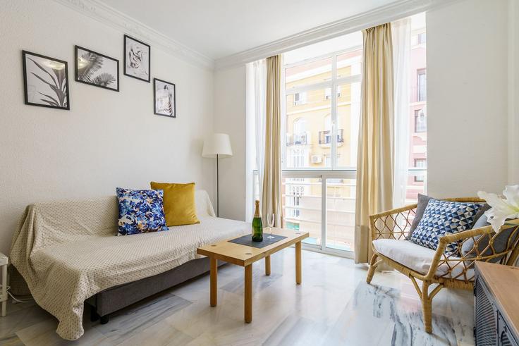 Elegantly designed living room with modern furnishings in an apartment at Building Calle Mármoles - salvador-martinez-muoz - 1331151 in Centro, Málaga