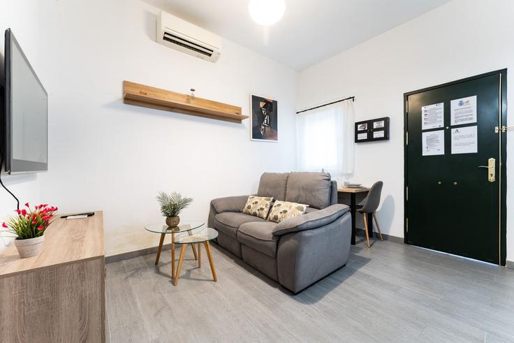 Elegantly designed living room with modern furnishings in an apartment at Building Calle Capitán Huelin - salvador-martinez-muoz - 1331230 in Centro, Málaga