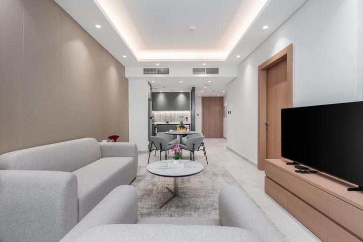 Elegant gestaltetes Wohnzimmer mit moderner Einrichtung in einer Wohnung im Building Orchid St - samaya-vacation-homes - 1373725 in Al Barsha South Fifth, Dubai