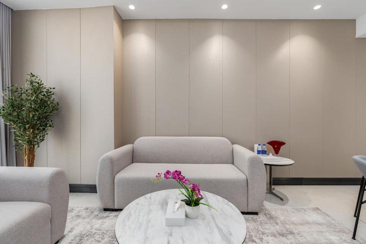 Elegantly designed living room with modern furnishings in an apartment at Building Orchid St - samaya-vacation-homes - 1375295 in Al Barsha South Fifth, Dubai