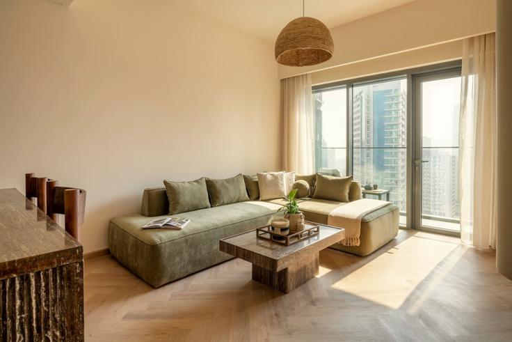 Elegantly designed living room with modern furnishings in an apartment at Building Burj Khalifa Boulevard - seraya-stays - 1499427 in Downtown Dubai, Dubai