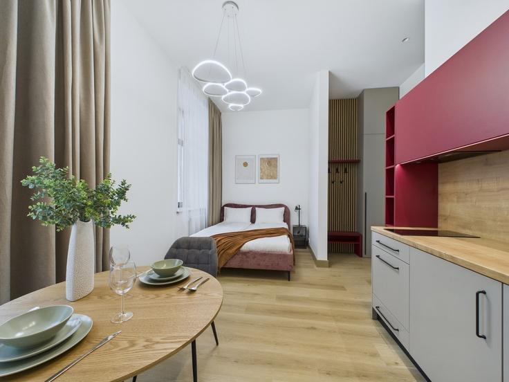 Elegante sala de estar con mobiliario moderno en un apartamento en Building Marijas iela 4 - sia-bnbverit - 1524186 en Central District, Riga Elegante sala de estar con mobiliario moderno en un apartamento en Building Marijas iela 4 - sia-bnbverit - 1524186 en Central District, Riga