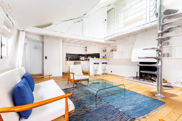 Sala de estar elegantemente projetada com móveis modernos em um apartamento no Building Rue Bonaparte - siegfried-vigier - 1253053 - PAR em 6th arrondissement, Paris