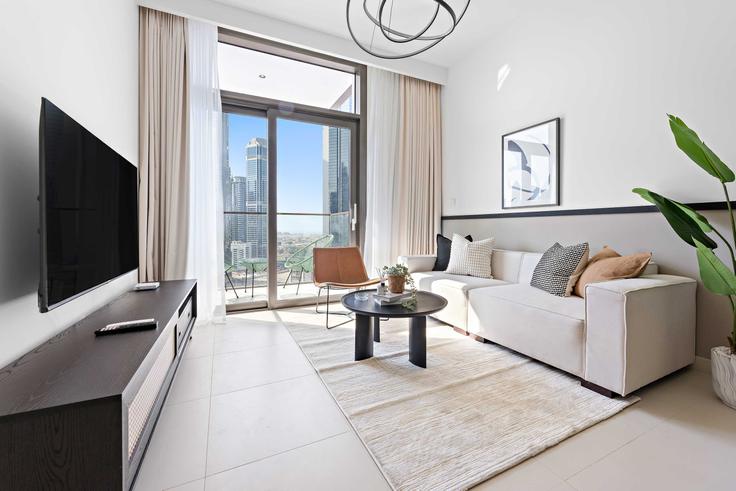 Elegante sala de estar con mobiliario moderno en un apartamento en Building Sheikh Mohammed bin Rashid Boulevard - silkhaus - 1044272 - DXB en Downtown Dubai, Dubai