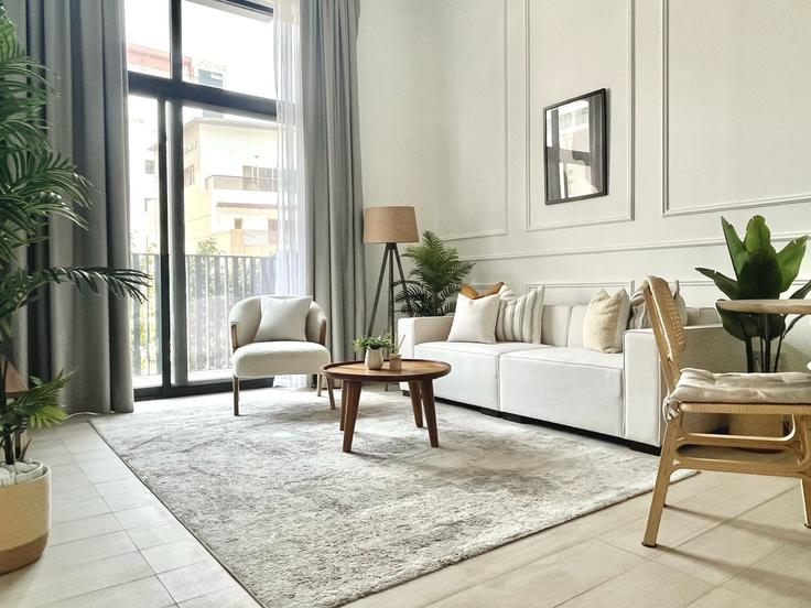Elegantly designed living room with modern furnishings in an apartment at Building Tariaq Bedon Esm - silkhaus - 1044114 - DXB in Jumeirah Village, Dubai